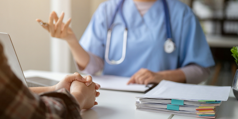 Doctor consults with a patient
