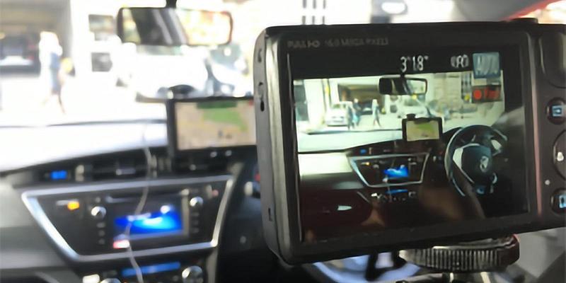Camera screen showing steering wheel and sat nav