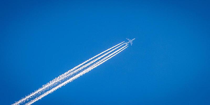 A plane travelling through the sky