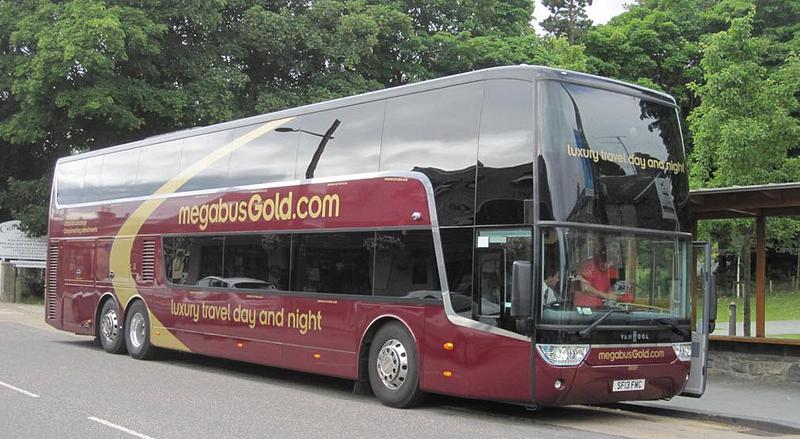 A Megabus gold at a bus stop